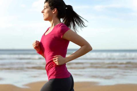 Woman running along the beach
